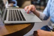 person typing on laptop