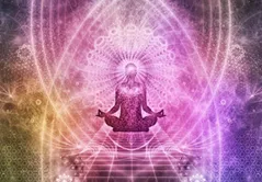Image of person sitting cross legged surrounded by pink aura.