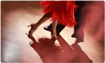 Man and woman dancing to Latin music