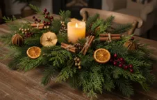 Winter centerpiece with faux balsam branches with dried fruits and cinnamon sticks.