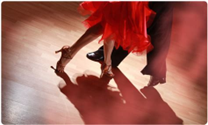 Man and woman dancing to Latin music