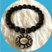 Bracelet with moon phase charm.